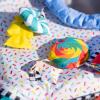imageBright Starts Pop N Jump Portable Activity Jumper IndoorOutdoor Use Sweet Treats with 4 Sensory Toys Ages 612 MonthsSweets